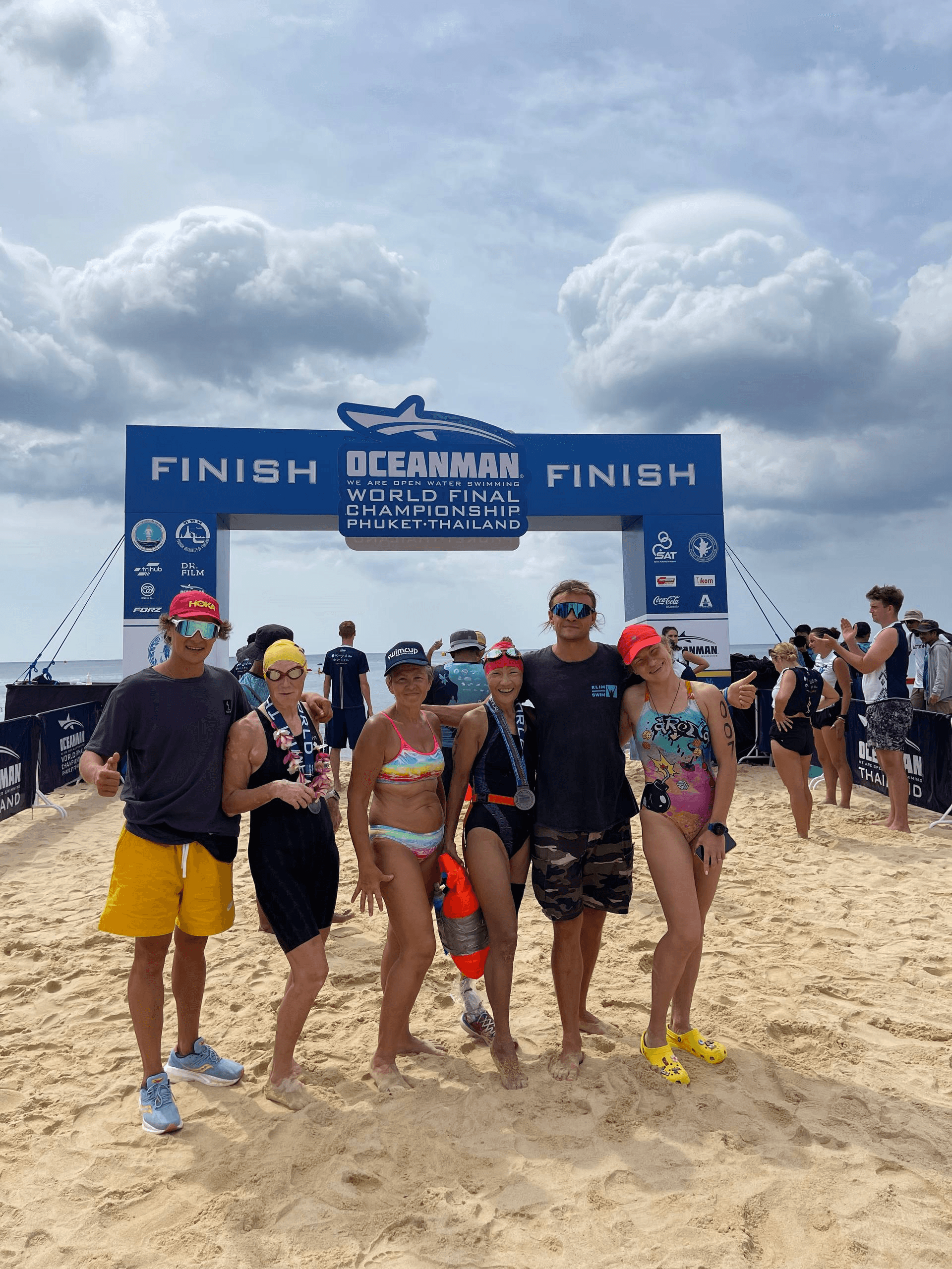 Camp participants at the open-water race finish in Phuket, Thailand, 2023